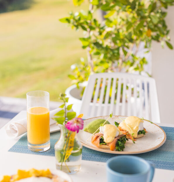 outdoor dining table with breakfast foods